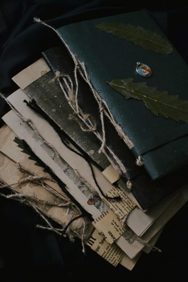Stack of vintage journals with rustic twine, evoking nostalgia and creativity.